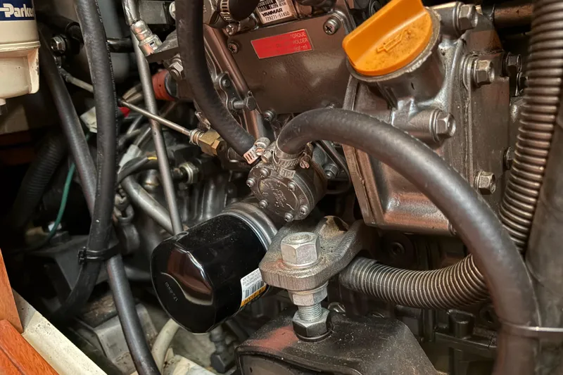 Tru Blu Yacht Photos Pics Engine components of a 2010 Hunter 39 boat, featuring hoses and filters.