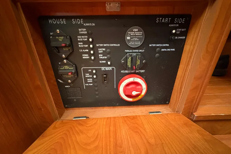Tru Blu Yacht Photos Pics Electrical control panel on a 2010 Hunter 39 sailboat, featuring battery switches and circuit controls.