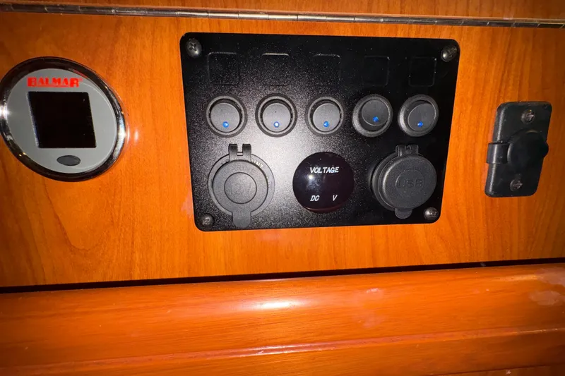 Tru Blu Yacht Photos Pics Control panel on a 2010 Hunter 39 boat with voltage and USB ports.