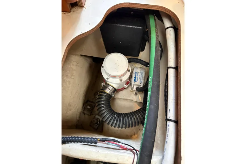 Tru Blu Yacht Photos Pics Bilge pump system in 2010 Hunter 39 sailboat, featuring hoses and wiring.