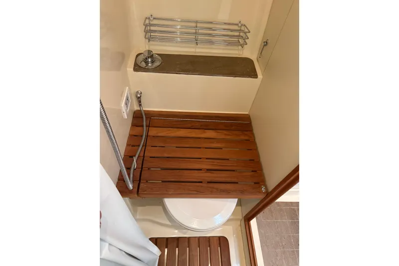 Tru Blu Yacht Photos Pics 2010 Hunter 39 yacht bathroom with wooden shower seat and modern fixtures.