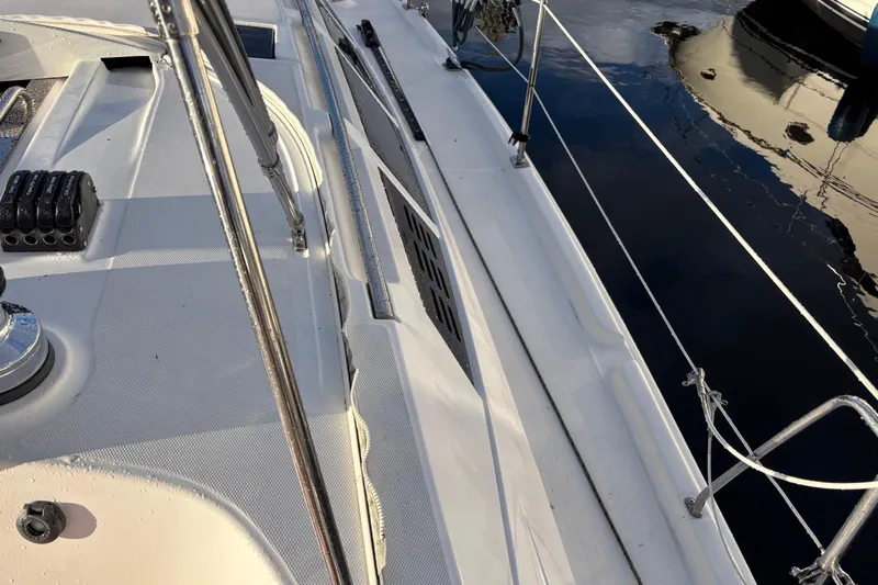 Tru Blu Yacht Photos Pics Deck view of a 2010 Hunter 39 sailboat, featuring rigging and winch details.