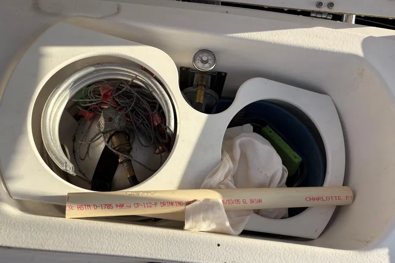 Tru Blu Yacht Photos Pics Boat storage compartment with ropes, hose, and cleaning supplies, Hunter 39, 2010 model.