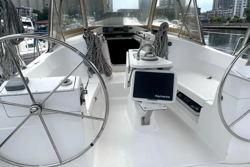 Tru Blu Yacht Photos Pics Cockpit of 2010 Hunter 39 sailboat with dual steering wheels and navigation equipment.