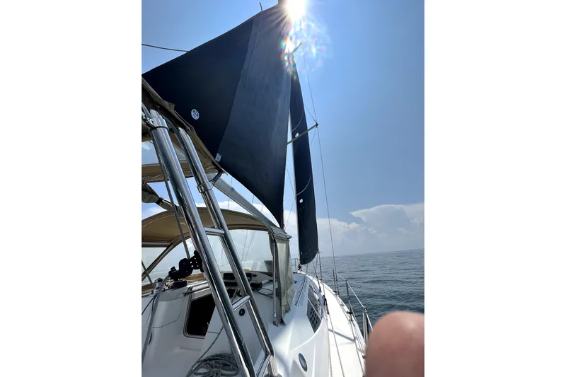 Tru Blu Yacht Photos Pics Sailing on a 2010 Hunter 39 yacht with blue skies and ocean view.