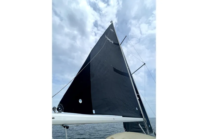 Tru Blu Yacht Photos Pics Sailboat with black sail on a cloudy day, Hunter 39 model, 2010.