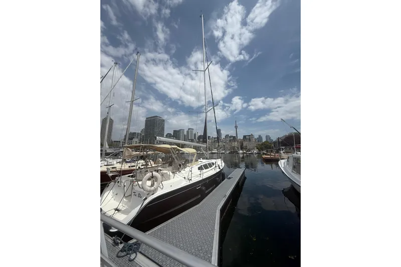 Tru Blu Yacht Photos Pics Sailboat docked in marina with city skyline, Hunter 39, 2010 model.
