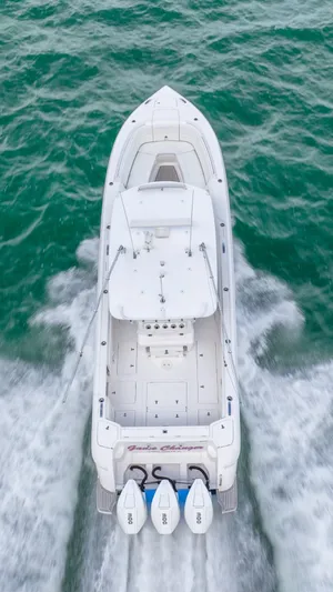  Yacht Photos Pics Aerial view of 2022 Intrepid 375 Nomad FE boat cruising on water.