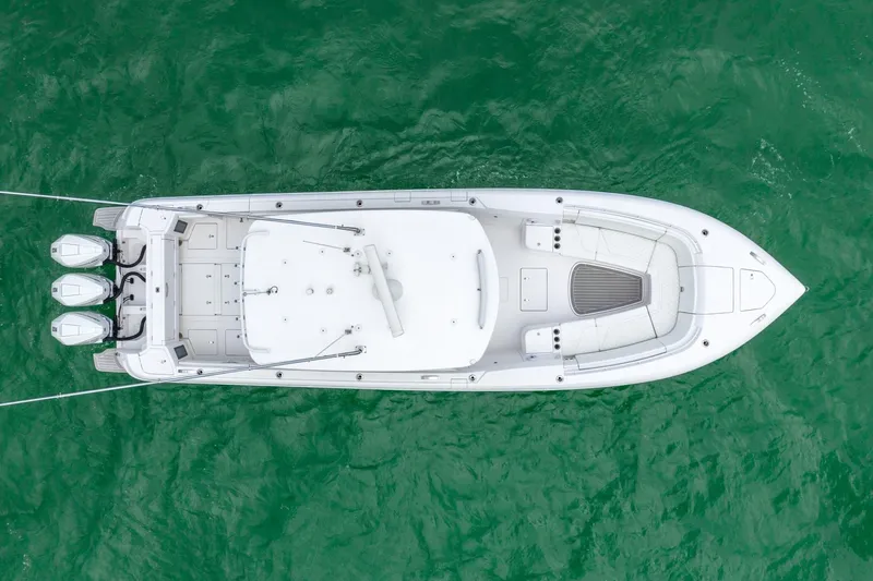  Yacht Photos Pics Aerial view of a 2022 Intrepid 375 Nomad FE boat on green water.