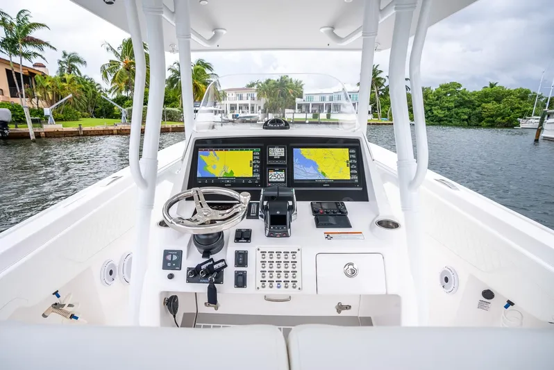  Yacht Photos Pics 2022 Intrepid 375 Nomad FE boat helm with dual navigation screens.