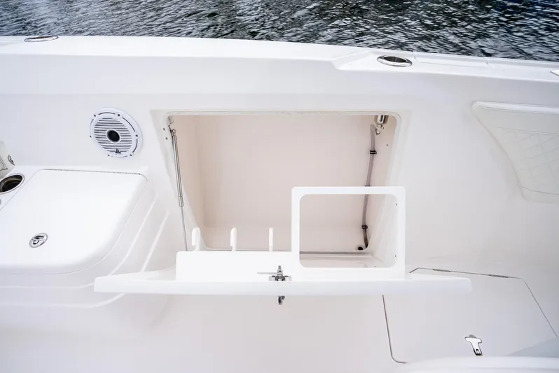  Yacht Photos Pics 2022 Intrepid 375 Nomad FE boat storage compartment and speaker.