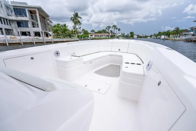  Yacht Photos Pics 2022 Intrepid 375 Nomad FE boat with spacious seating area and modern design.