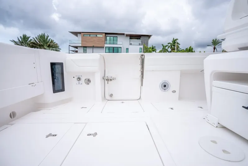  Yacht Photos Pics 2022 Intrepid 375 Nomad FE boat deck with modern amenities.