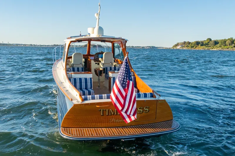 Timeless (name Reserved) Yacht Photos Pics 2015 Hinckley Picnic Boat MK III cruising on open water, American flag displayed.