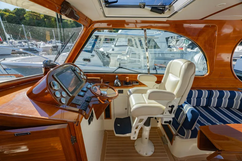 Timeless (name Reserved) Yacht Photos Pics Interior of 2015 Hinckley Picnic Boat MK III with luxurious helm and seating.