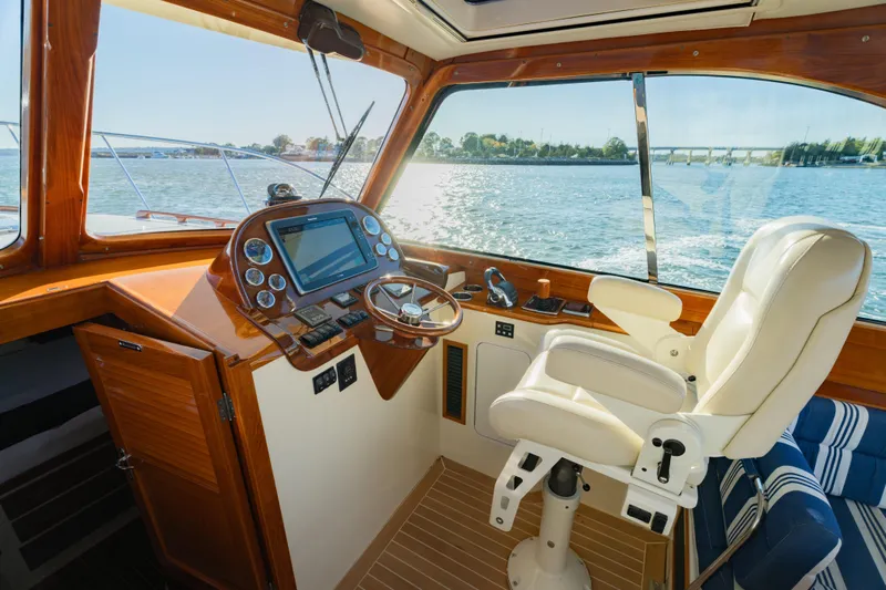 Timeless (name Reserved) Yacht Photos Pics Interior of 2015 Hinckley Picnic Boat MK III with helm and luxurious seating.