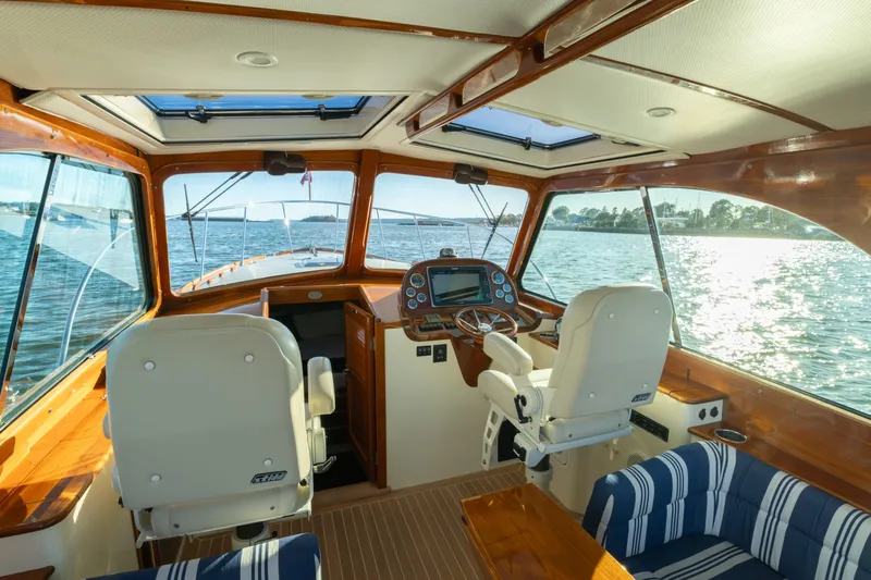 Timeless (name Reserved) Yacht Photos Pics Interior of 2015 Hinckley Picnic Boat MK III with scenic water view.