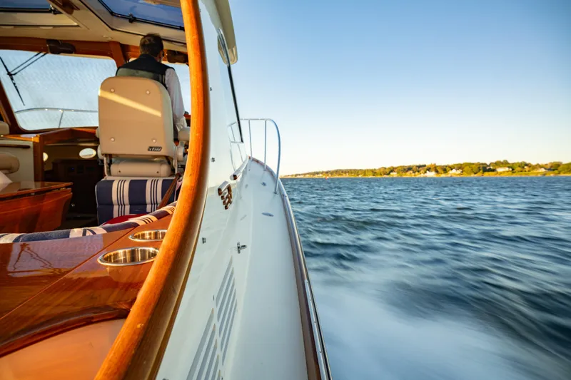 Timeless (name Reserved) Yacht Photos Pics 2015 Hinckley Picnic Boat MK III cruising on a sunny day, interior view.