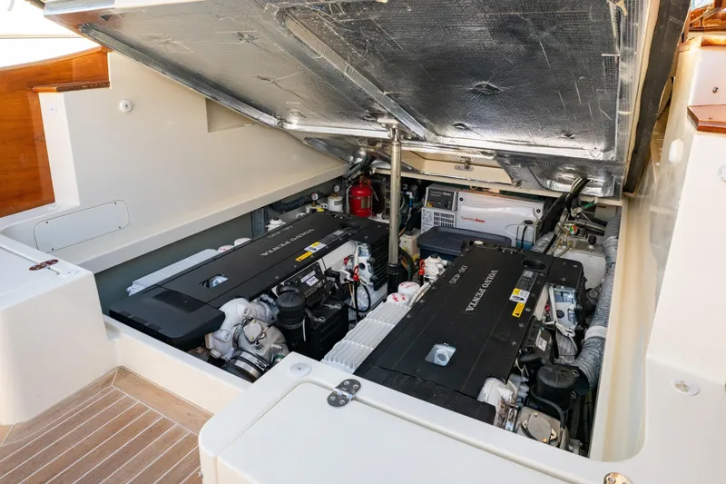 Timeless (name Reserved) Yacht Photos Pics Engine compartment of a 2015 Hinckley Picnic Boat MK III, showcasing dual Volvo Penta engines.