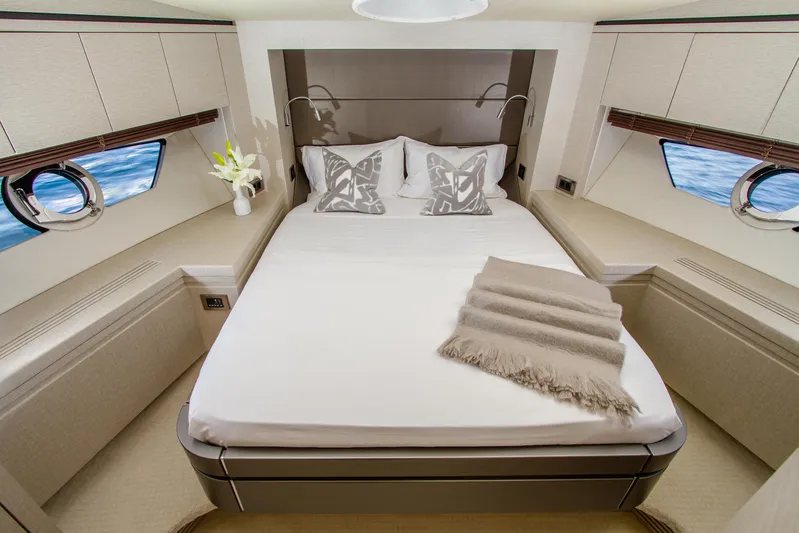 Outlaw Yacht Photos Pics Luxurious bedroom interior of 2015 Sunseeker Manhattan 55 yacht with elegant decor.