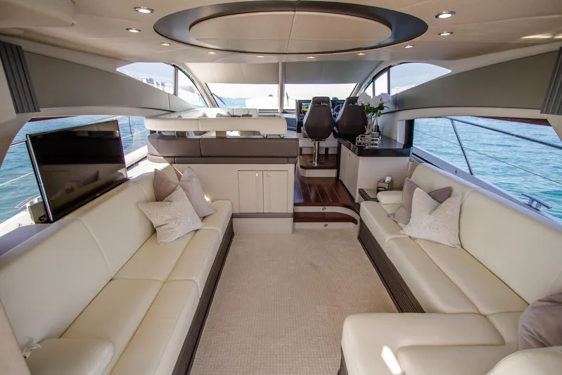 Outlaw Yacht Photos Pics Luxurious interior of 2015 Sunseeker Manhattan 55 yacht with elegant seating and modern design.