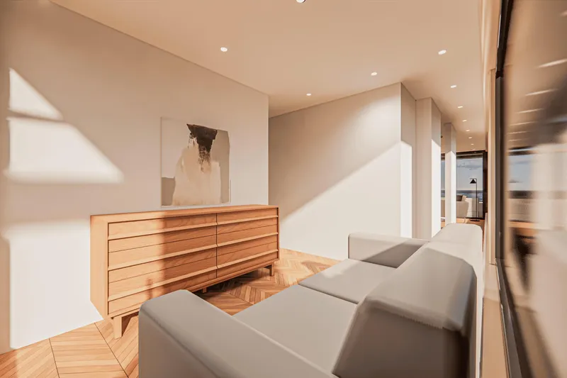  Yacht Photos Pics Modern interior with wooden sideboard, abstract art, and sleek gray sofa in a sunlit room.