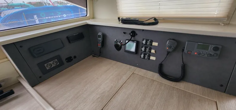 Jolly Dacha Yacht Photos Pics Control panel of a 2015 Leopard 48 yacht with communication devices and switches.