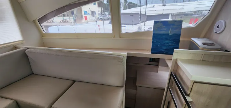 Jolly Dacha Yacht Photos Pics Interior of 2015 Leopard 48 yacht with modern seating and large windows.