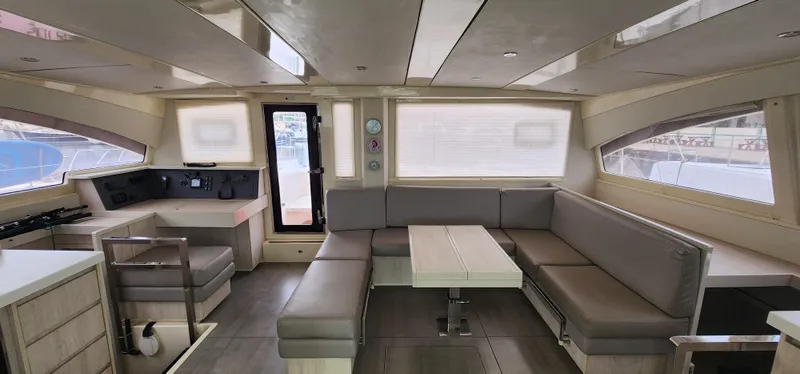 Jolly Dacha Yacht Photos Pics Luxurious interior of 2015 Leopard 48 yacht with modern seating and dining area.