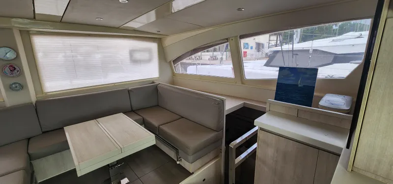 Jolly Dacha Yacht Photos Pics Luxurious interior of 2015 Leopard 48 yacht with modern seating and dining area.