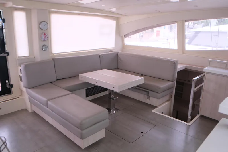 Jolly Dacha Yacht Photos Pics Spacious interior of 2015 Leopard 48 yacht with modern seating and dining area.