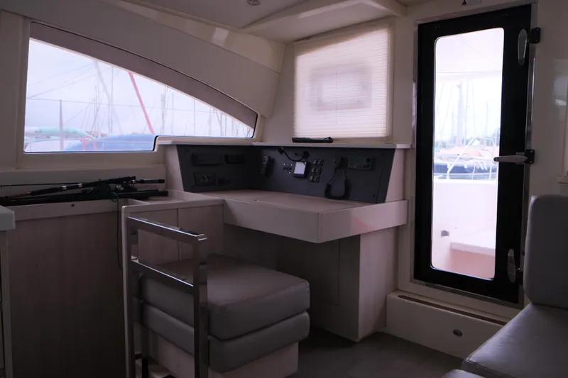 Jolly Dacha Yacht Photos Pics Interior of 2015 Leopard 48 yacht with helm station and seating area.