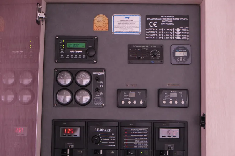 Jolly Dacha Yacht Photos Pics Control panel of a 2015 Leopard 48 yacht with various gauges and switches.