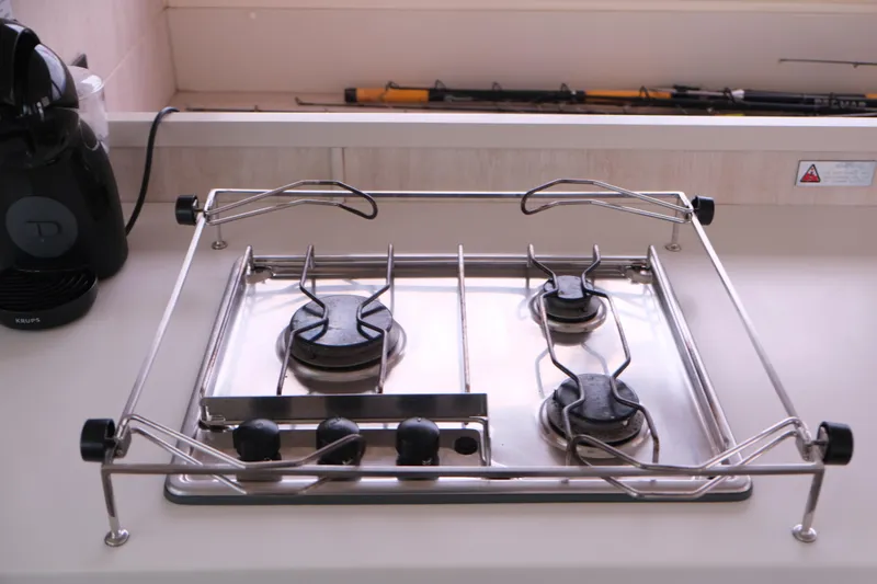 Jolly Dacha Yacht Photos Pics Stainless steel gas stove on Leopard 48 yacht, 2015 model, with four burners.