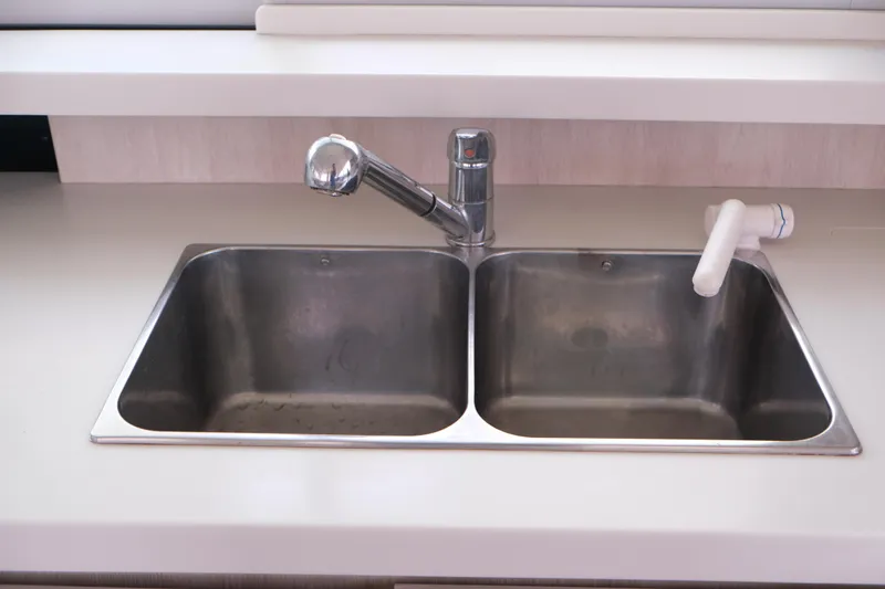 Jolly Dacha Yacht Photos Pics Stainless steel double sink with modern faucet in Leopard 48 yacht, 2015 model.