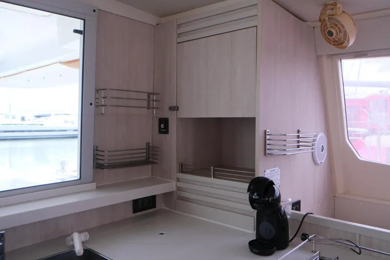 Jolly Dacha Yacht Photos Pics Modern kitchen area in a 2015 Leopard 48 yacht with coffee maker and storage.