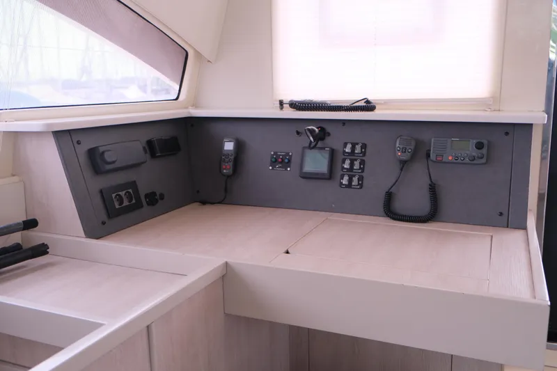 Jolly Dacha Yacht Photos Pics Control panel of a 2015 Leopard 48 yacht with communication devices and switches.