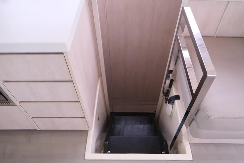 Jolly Dacha Yacht Photos Pics Interior of 2015 Leopard 48 yacht with stairs and modern cabinetry.