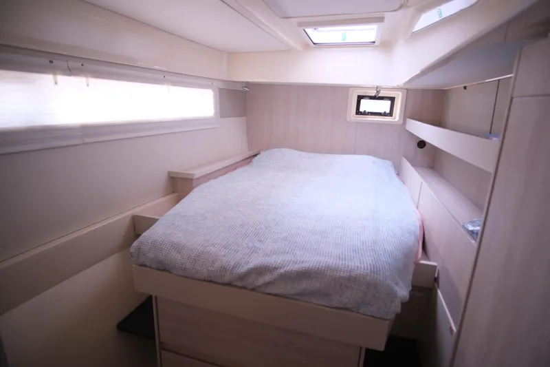 Jolly Dacha Yacht Photos Pics Cozy bedroom interior of 2015 Leopard 48 yacht with skylight and modern design.