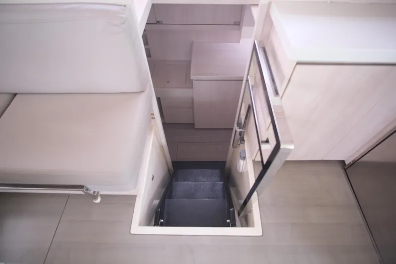 Jolly Dacha Yacht Photos Pics Interior of 2015 Leopard 48 yacht showing stairs to lower deck.