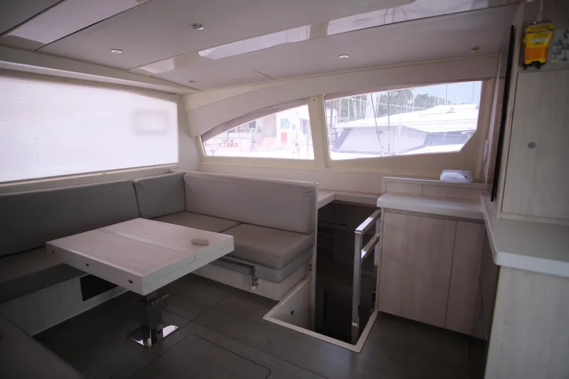 Jolly Dacha Yacht Photos Pics Luxurious interior of 2015 Leopard 48 yacht with modern seating and dining area.