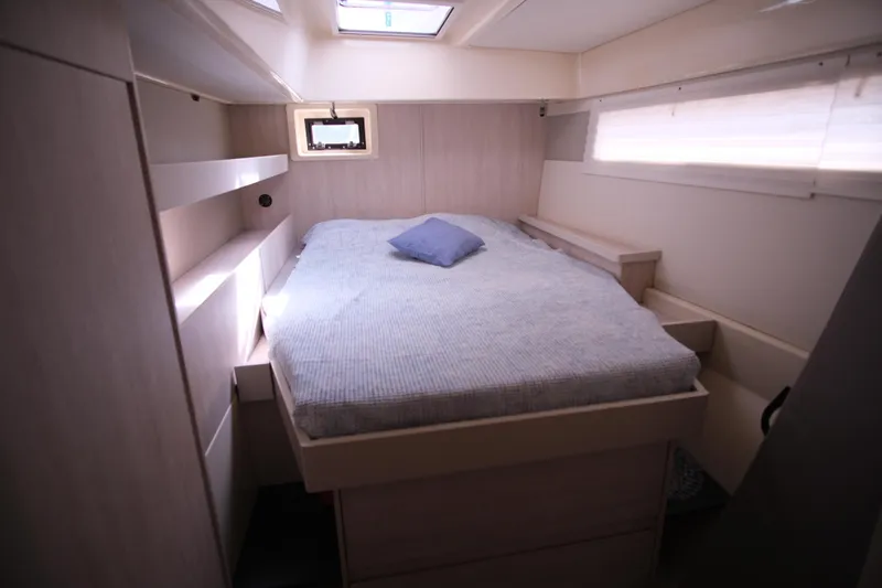 Jolly Dacha Yacht Photos Pics Luxurious cabin interior of 2015 Leopard 48 yacht with cozy bed and skylight.