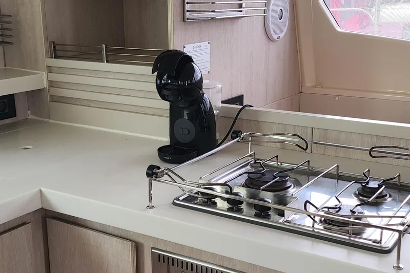 Jolly Dacha Yacht Photos Pics Modern kitchen in 2015 Leopard 48 yacht with stove and coffee maker.