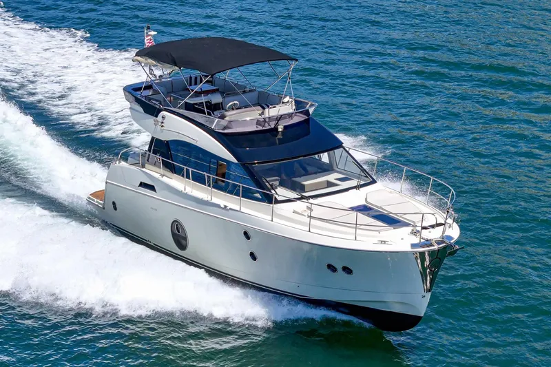 The Riviera Yacht Photos Pics 2017 Monte Carlo MC5S yacht cruising on open water, showcasing sleek design and luxury features.