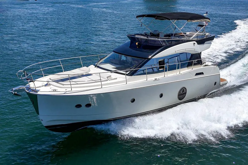 The Riviera Yacht Photos Pics 2017 Monte Carlo MC5S yacht cruising on open water, showcasing sleek design and luxury.