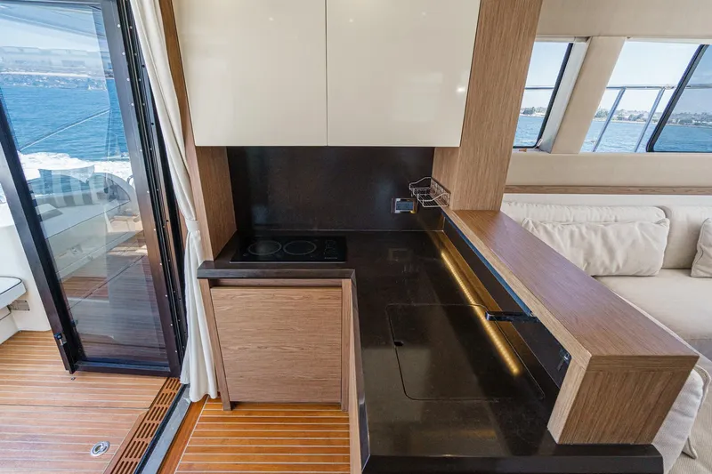 The Riviera Yacht Photos Pics Luxurious 2017 Monte Carlo MC5S yacht interior with modern kitchen and ocean view.