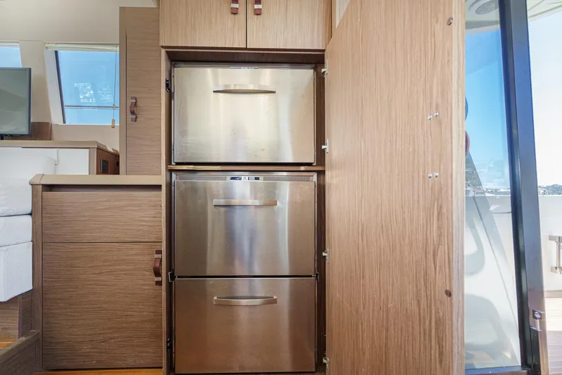 The Riviera Yacht Photos Pics Modern kitchen area in 2017 Monte Carlo MC5S yacht with stainless steel appliances.