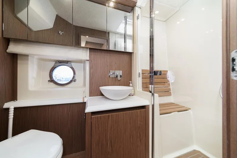 The Riviera Yacht Photos Pics Luxurious 2017 Monte Carlo MC5S yacht bathroom with modern fixtures and wooden accents.