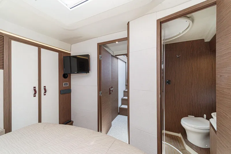 The Riviera Yacht Photos Pics Luxurious interior of 2017 Monte Carlo MC5S yacht, featuring bedroom and bathroom.