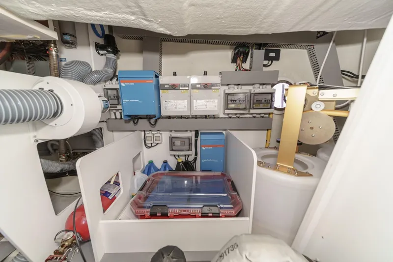 The Riviera Yacht Photos Pics 2017 Monte Carlo MC5S engine room with electrical systems and storage compartments.